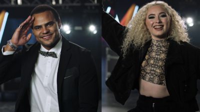 En bild på Mohomdi och en bild på Wiktoria. Båda står i ett rum med strålkastare bakom sig. Wiktoria ser jätteglad ut och sträcker ut armarna i luften. Mohombi ser också glad ut och håller ena handen mot tinningen som en hälsning.